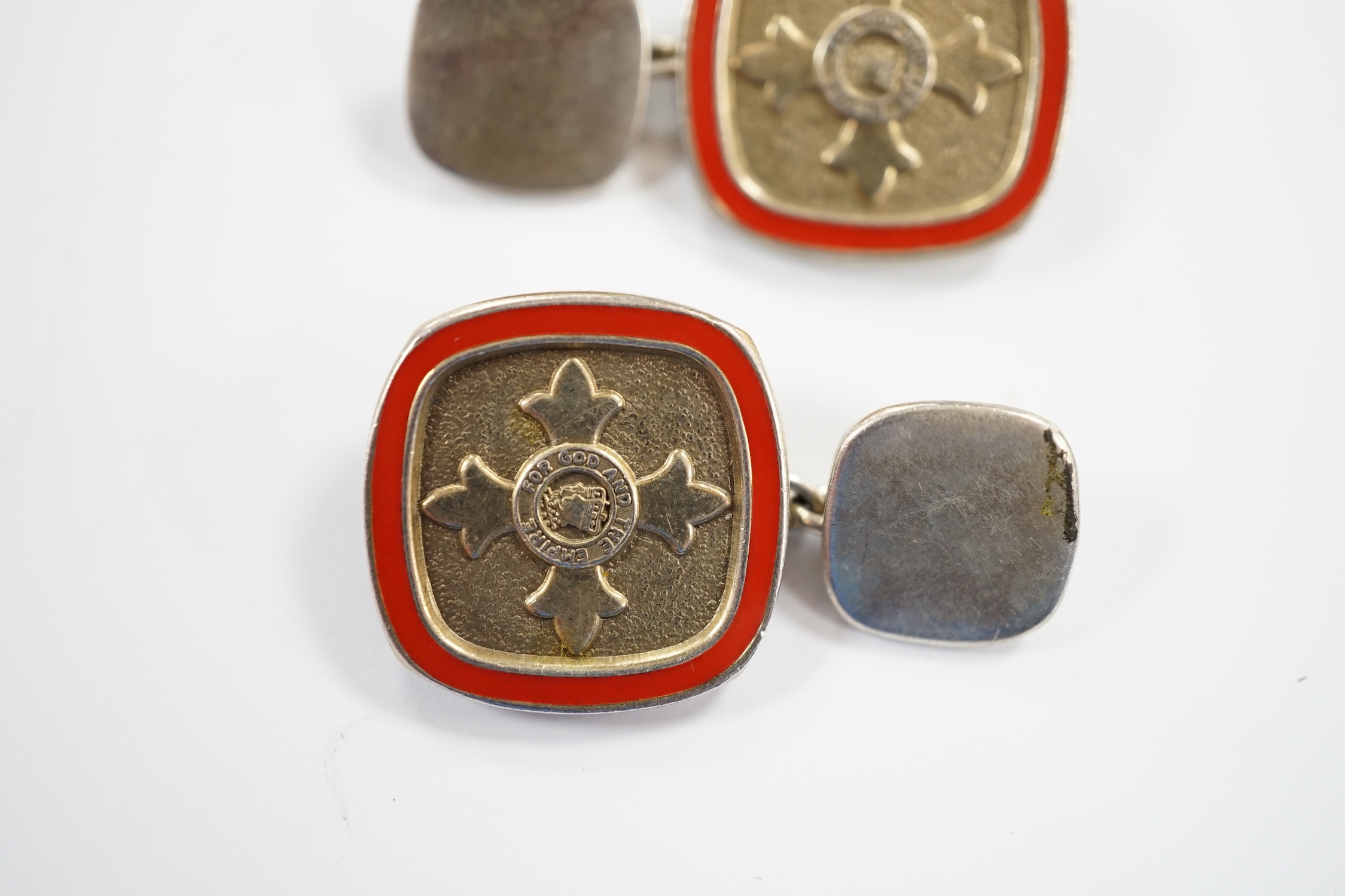 A modern pair of silver and red enamel cufflinks, embossed with the Order of The British Empire, by Toye, Kenning & Spencer, 19mm.